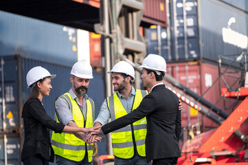 group of businessman, Logistics engineer and inspector and businessman cheer up  and happy to about success business deal and project in shipping containerin commercial transport port