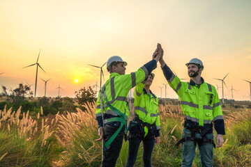 Team Engineers men and woman checking and inspecting on construction with sunset sky. people...