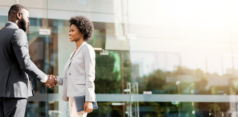 Nice to meet you. Two young african american business people introducing outdoors, copy space