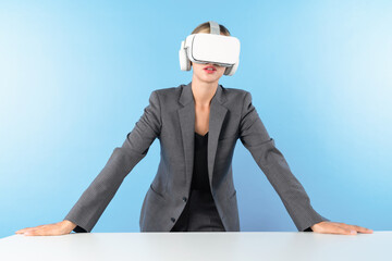 Project manager wearing VR headset and standing while holding innovation technology hologram....