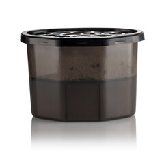 Moisture absorber half filled with hygroscopic granules visible through semi-transparent brown container, with vented black lid on top and clean label area for branding or product information.
