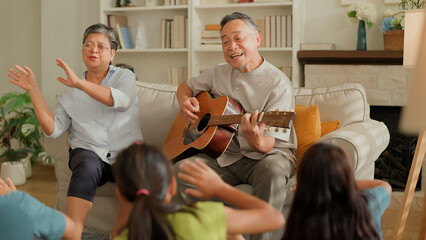 asian family Happy Multi Generation Family is Spending wonderful time at home Grandfather is...