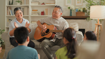 asian family Happy Multi Generation Family is Spending wonderful time at home Grandfather is...