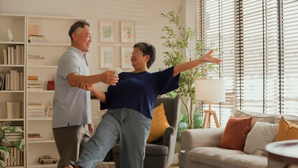 asian senior happiness couple home isolation concept,asian old retired adult couple dancing...