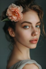  A woman holds one flower in her hair