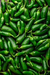 Background with Green Jalapeno Peppers. View from Above