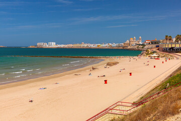 Playa de la Santamaria beach and Cathedral de Santa Cruz in the morning in Cadiz, Andalusia, Spain