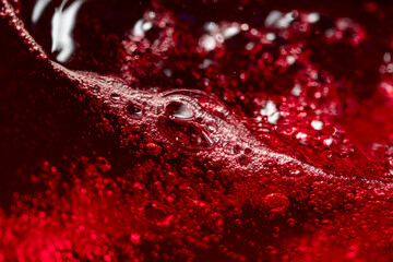 Red wine abstract splashing in glass.