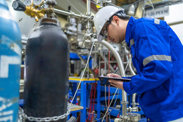 Asian engineer working at Operating hall,Thailand people wear helmet  work,He worked with diligence...