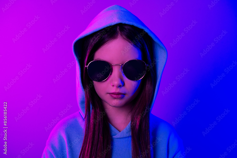 Poster photo of cool funky little lady dressed hoodie dark gallses looking you empty space isolated neon pi