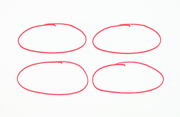 Four red circles on a white background.