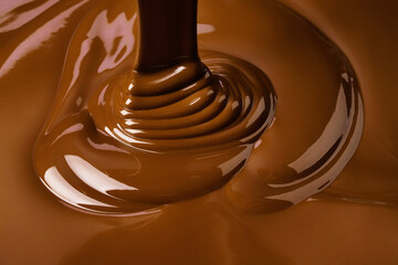 splash of melt chocolate. sweet cocoa dessert, dark chocolate background