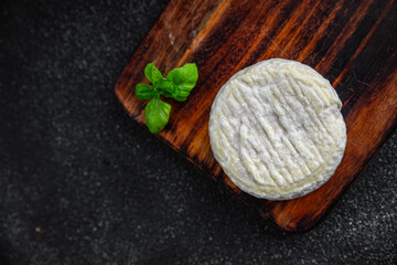soft cheese cow milk, goat or sheep cheese natural fresh appetizer meal food snack on the table...