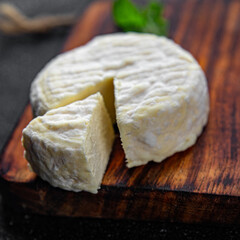 soft cheese cow milk, goat or sheep cheese natural fresh appetizer meal food snack on the table copy space food background rustic top view