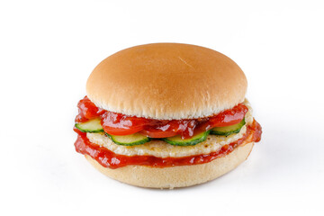 Hamburger with gherkin, lettuce, onions and ketchup