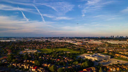 Aerial view of vast urban landscape with industrial and residential areas.