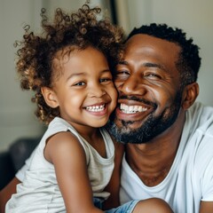 Close-up of a happy father and son smiling indoors, highlighting their joyful and loving relationship.