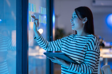 business woman writing in office for solution,Schedule,calendar and manager with storyboard notes...