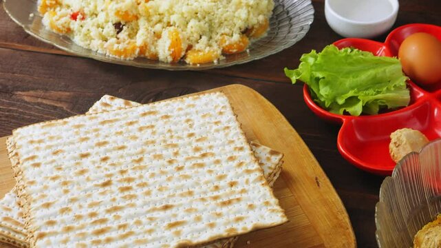 Matzo and kearah on the set table for the Pesach Seder meal. Vertical panorama