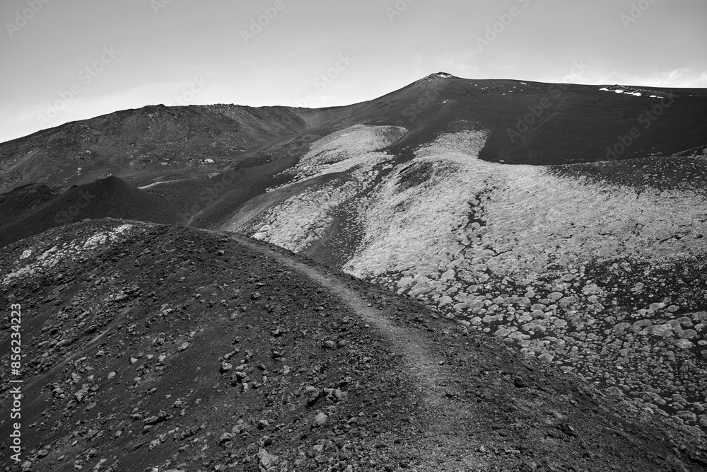 Wall mural solidified lava and old craters on the slope of the active volcano etna on the island of sicily