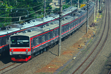 Fototapeta premium View of a passenger train moving in a rural or hilly area