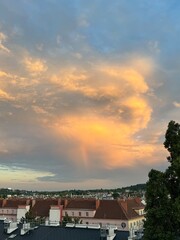 Thunderstorm Cell with Rainbow and Blue Sky"