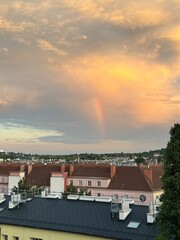 Thunderstorm Cell with Rainbow and Blue Sky"