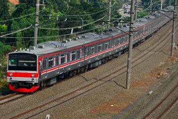Naklejka premium View of a passenger train moving in a rural or hilly area