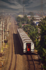 Obraz premium View of a passenger train traveling in a rural area