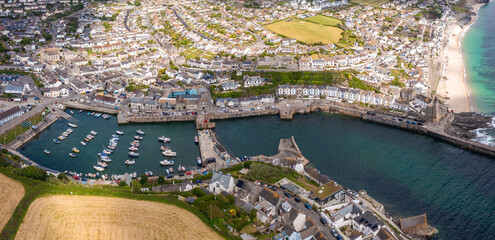 Aerial view of the Cornish fishing town of Porthleven with harbour and boats