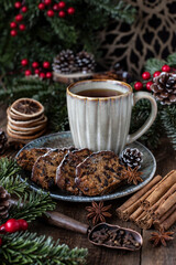 Mug with hot tea and  Christmas cake with dried fruits and nuts