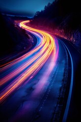 Light streaks from moving cars on curved road in black background - motion, urban nightscape, transportation