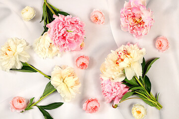 Abstract floral arrangement, flat lay, beautiful peonies on an elegant background, spring and summer banner. Creative modern bouquet. Mother's Day card, happy birthday, wedding,