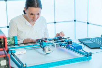 young female student studying industrial laser