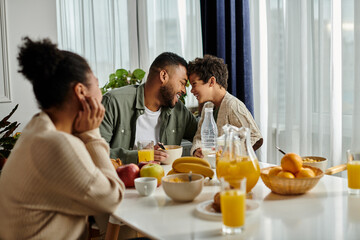 African american family enjoying meal and bonding at table.