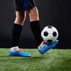 Grass, soccer player and foot with ball for training, game and action for practice with shoes....