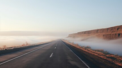 Highway fading into thick fog.
