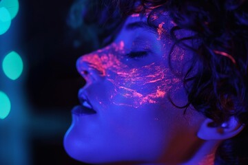 Purple nightclub lighting on a person's face