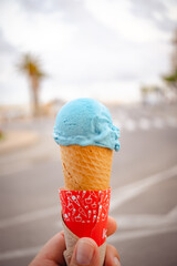 blue ice cream cone with blurred background