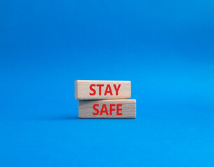 Stay Safe symbol. Concept word Stay Safe on wooden blocks. Beautiful blue background. Business and Stay Safe concept. Copy space