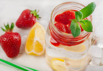 drink with strawberry lemon and mint on white