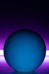 moon figure with realistic texture illuminated with purple light