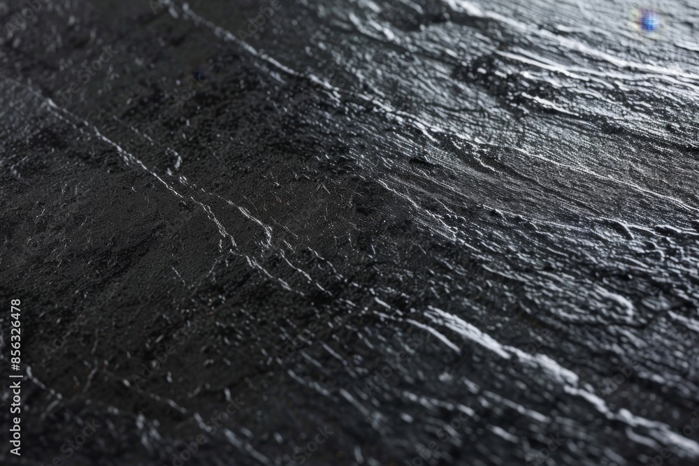 Poster striking black slate background with rough texture and intricate stone details, ideal for design pro