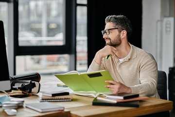 A handsome businessman with a beard sits at a desk in a modern office, thoughtfully reviewing documents.