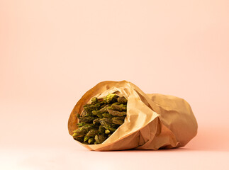 a bunch of green asparagus in kraft paper