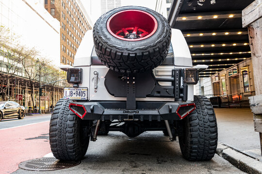 New York City, USA - April 28, 2024: Jeep Gladiator pickup truck car parked outdoor, back view