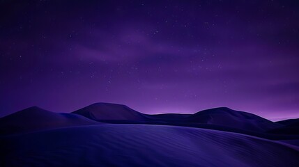 A purple sky with stars over a desert.