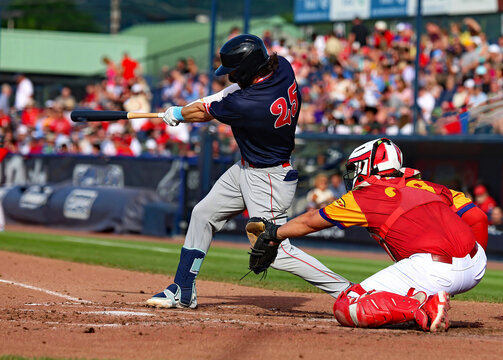 25 baseball player hard left swing