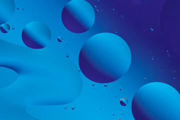 Colorful blue abstract background with bubble-like shapes.