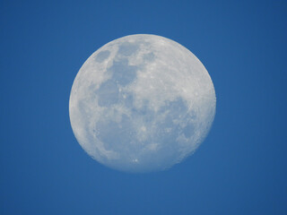 full moon in the blue sky